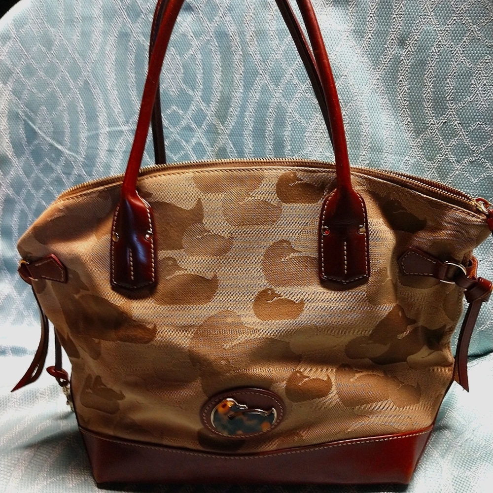 Dooney and Bourke two tone brown with leather trim used smoke and pet free.